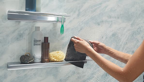 view of shower shelves with accessories